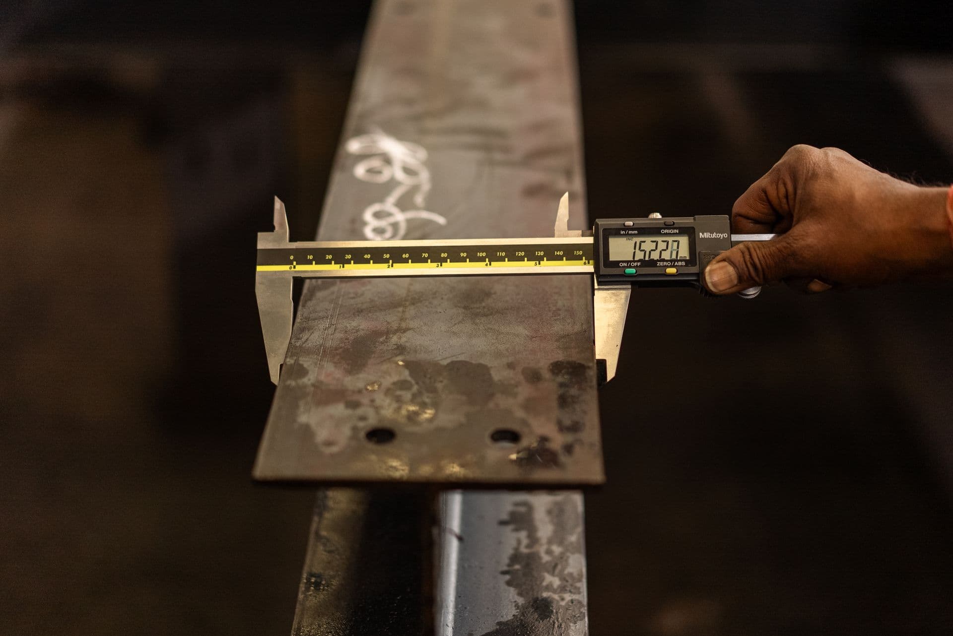Quality technician measuring cast aluminium